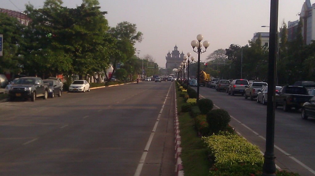 a street with cars and trees