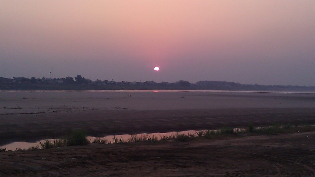 a sunset over a beach