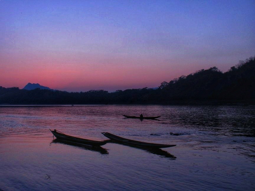 sunset at the mekong river one of the Luang Prabang top things to do