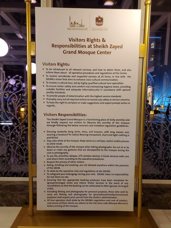 sign at the Sheikh Zayed Grand Mosque Center with rules for visitors
