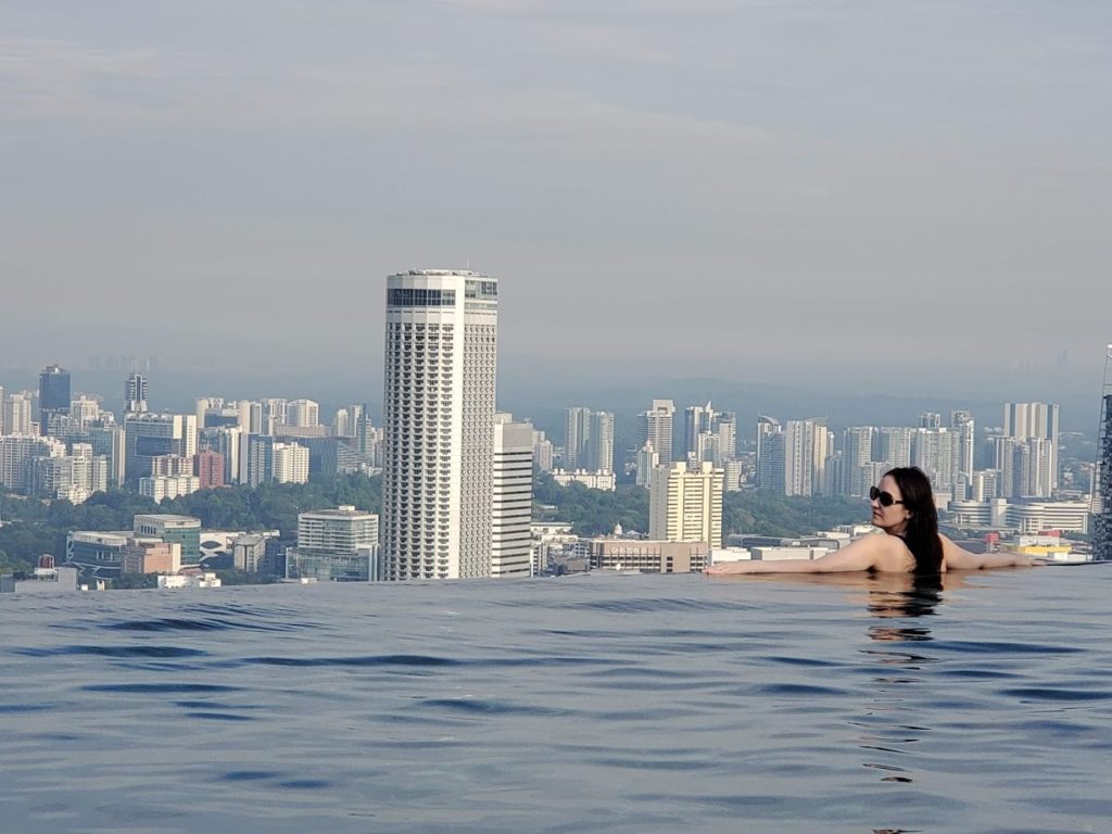me relaxing at the Marina Bay Sands infinity pool the most famous of the Singapore rooftop pools