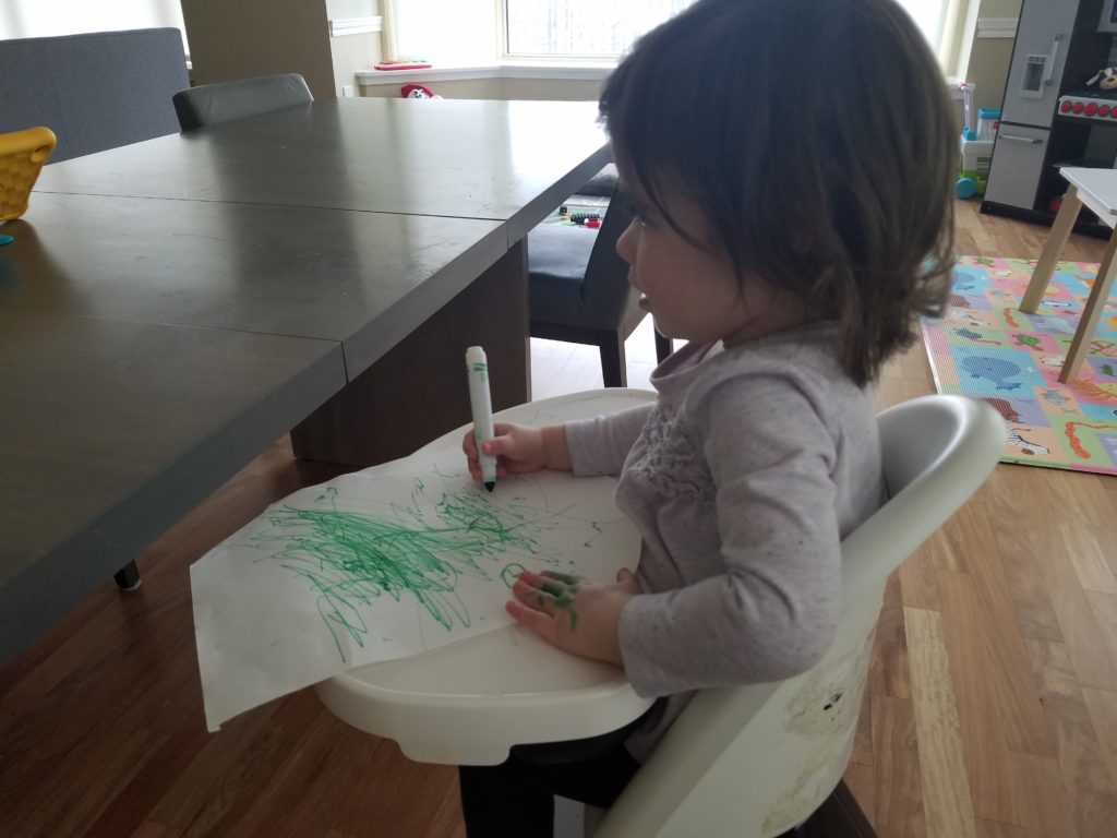 My toddler drawing with markers inside