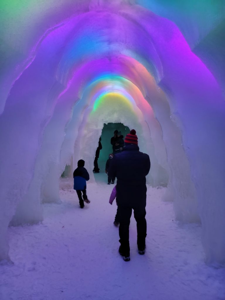 people inside the ice castles in Lake Geneva Wisconsin