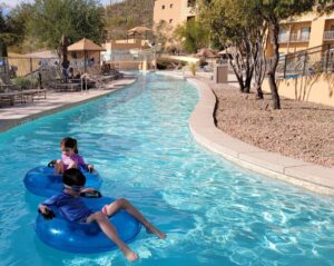kids on inner tubes in a pool at JW Marriott Tucson Starr Pass Resort & Spa is a family friendly hotel