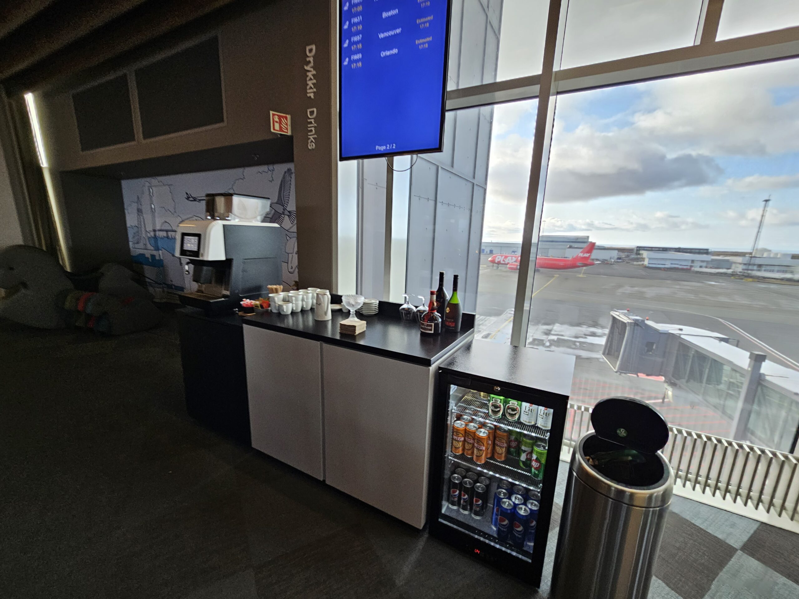 a coffee machine and drinks in the Iceland Saga airport lounge